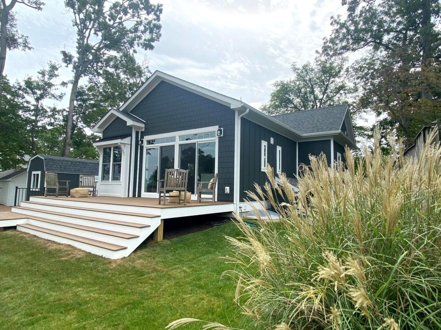 The Front of a House With Black and White Paint